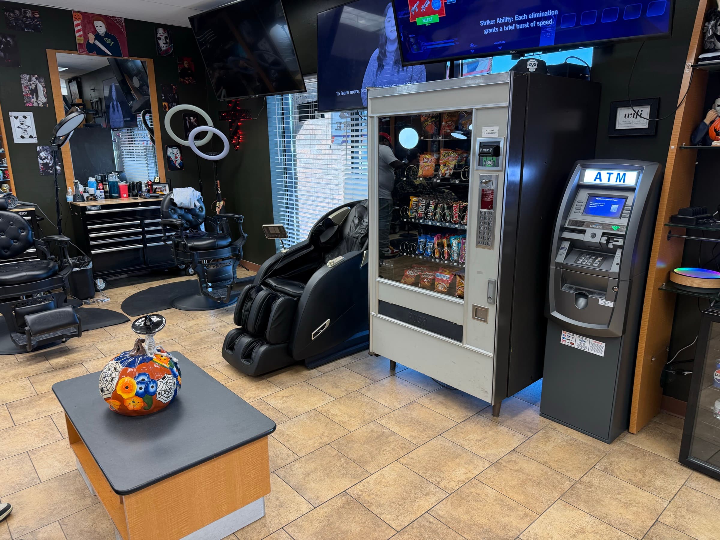 Massage chair, vending machine, ATM, and gaming TV in the Phantom Fades waiting area